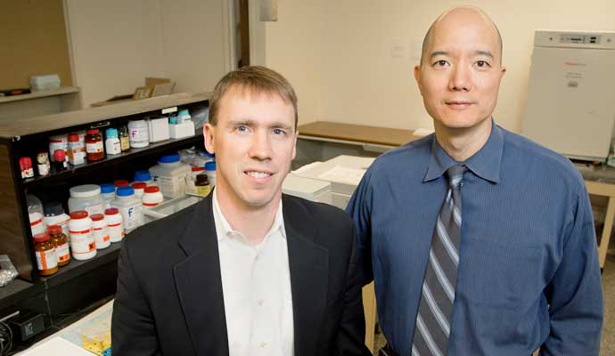 University of Illinois chemistry professor Paul Hergenrother, left, and veterinary clinical medicine professor Timothy Fan tested an anti-cancer compound in pet dogs that will be used in human clinical trials.