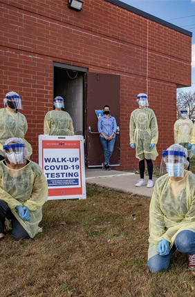 Workers gather at the Rantoul Parks and Recreation Department before hosting a pop-up test clinic. Rantoul has had outbreaks among essential worker populations, and the LHEAP team hopes to develop a better understanding of COVID-19 infection rates and why some areas generate acute infection clusters.