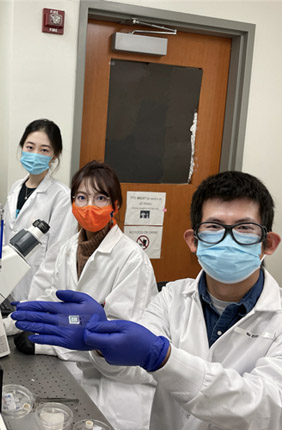 A team at the Holonyak Micro & Nanotechnology Lab displays new COVID-19 antibody test. 