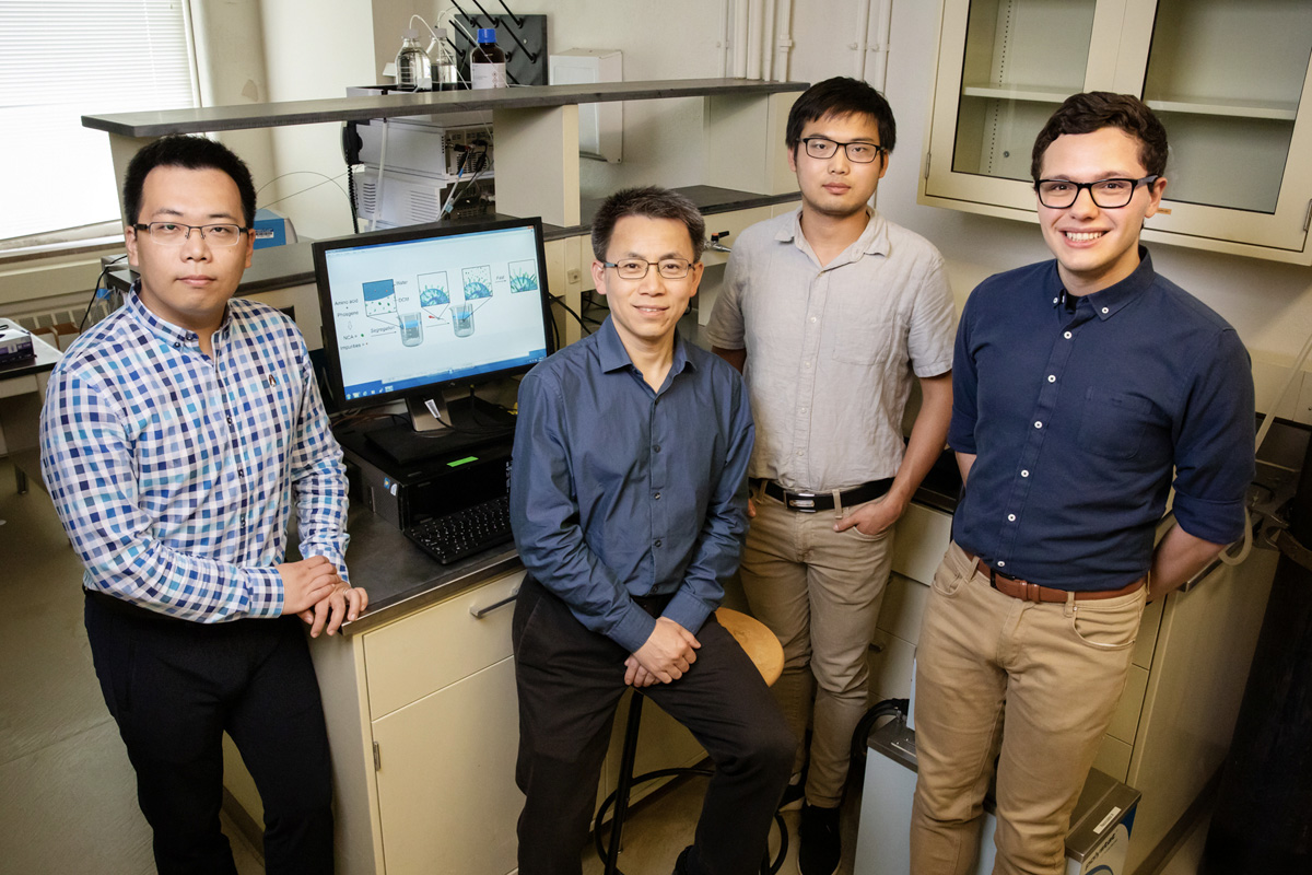A team including, from left, postdoctoral researcher Ziyuan Song, professor Jianjun Cheng and graduate students Tianrui Xue and Lazaro Pacheco, developed a new method that streamlines the construction of amino acid building blocks that can be used in a multitude of industrial and pharmaceutical applications. 