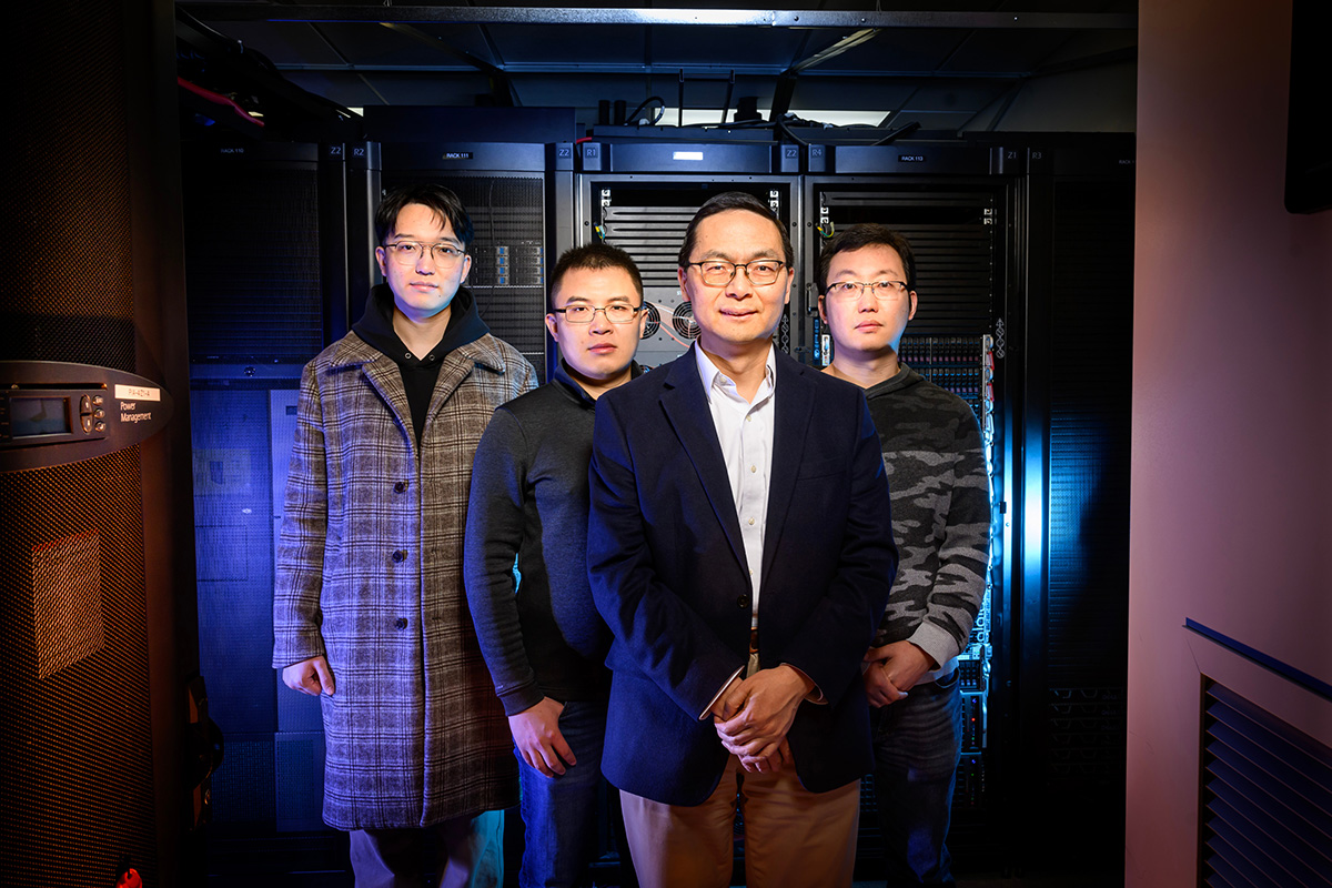 An Illinois research team created an AI tool to predict an enzyme’s function from its sequence using the campus network and resource group servers. Pictured, from left: Tianhao You, Haiyang (Ocean) Cui, Huimin Zhao and Guangde Jiang. 