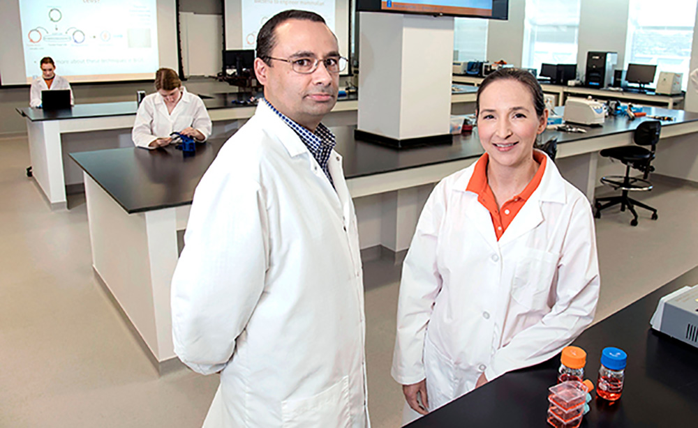 Pablo Perez-Pinera, left, and Karin Jensen developed remote laboratory exercises to help students learn common lab techniques.