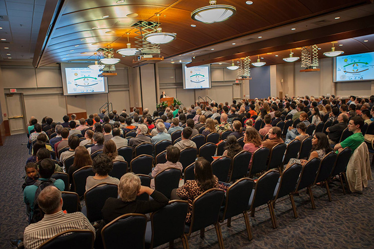 The audience at the Alice Campbell Alumni Center listens to Penny Chisholm's friday night public lecture, “Tiny Cells, Global Impact: A Journey of Discovery with a Microbe from the Sea.” 