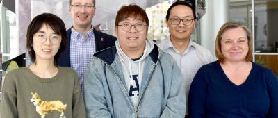 The research team included: first row, left to right, Ivy (Wuying) Tang, first author Harry (Shih-I) Tan, and Teresa Martin; back row, CABBI co-PIs Jeremy Guest (left) and Huimin Zhao. / Julie Wurth