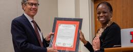 State Representative Carol Ammons (right) presented Gene Robinson a copy of House Resolution 0690.