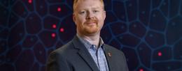 Andrew Leakey and his colleagues developed an AI tool that uses minimal training to teach itself to distinguish the flowers of thousands of varieties of Miscanthus, a plant used in biofuels production. Photo by Craig Pessman