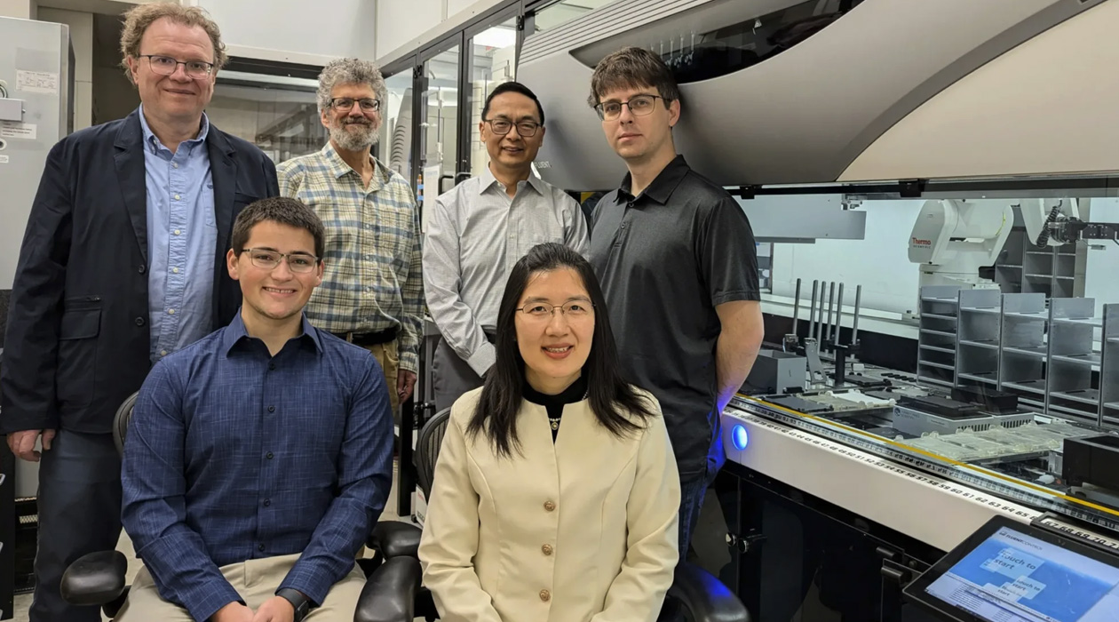 The CABBI research team and the iBioFAB biofoundry at the Carl R. Woese Institute for Genomic Biology (IGB). Front row, Graduate Student Seth Croslow and Research Scientist Jia Dong. Back row, from left: Co-PIs Mathew Hudson, Jonathan Sweedler, Huimin Zhao and Biofoundry Manager Stephan Lane. Credit: Julie Wurth/CABBI