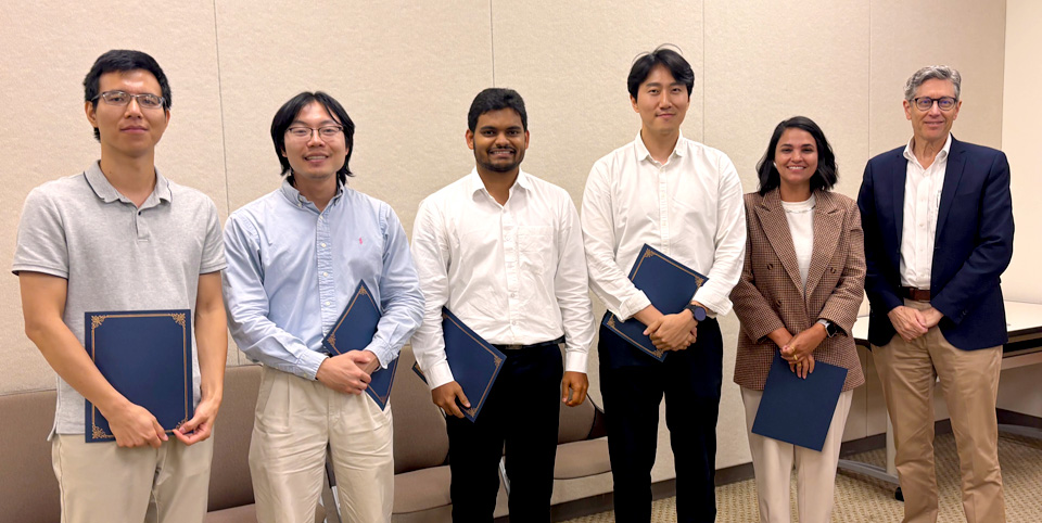 Following the pitch competition on July 29, participants in the summer EIP program (left to right): Quanhui Ye, Joshua Ye, Seemesh Bhaskar, Han Keun Lee, and Lauana Pereira de Oliveira, were presented with certificates by IGB Director Gene Robinson. 