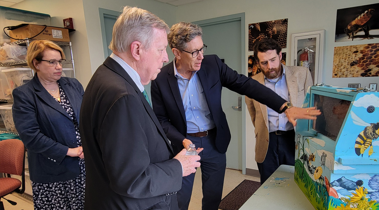 Senator Dick Durbin (left center) visits the Bee Research Facility, with Vice Chancellor of Research and Innovation Susan Martinis (left), IGB Director Gene Robinson (right center) and entomology professor and co-director of the Illinois Bee Research Facility Adam Dolezal.