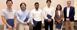 Following the pitch competition on July 29, participants in the summer EIP program (left to right): Quanhui Ye, Joshua Ye, Seemesh Bhaskar, Han Keun Lee, and Lauana Pereira de Oliveira, were presented with certificates by IGB Director Gene Robinson. 