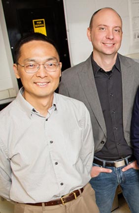 Professor Huimin Zhao with professor Charles Schroeder.