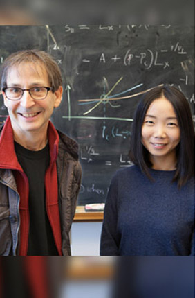 U of I Swanlund Professor of Physics Nigel Goldenfeld (left) works with colleague Chi Xue (right) at the Carl R. Woese Institute for Genomic Biology.