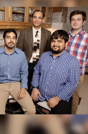 Biochemistry professor Auinash Kalsotra, second from left, and his team, including, from left, graduate students Waqar Arif, Joseph Seimetz and Sushant Bangru, uncovered the molecular underpinnings of liver regeneration.