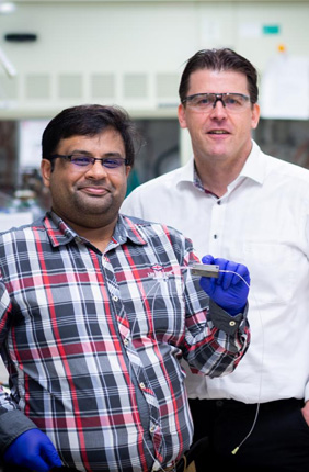 Graduate student Saket Bhargava (left) and Chemical and Biomolecular Engineering Professor and Department Head Paul Kenis (right) report reducing the energy required for CO2 electrolysis by more than 60% in a flow electrolyzer using magnetism.