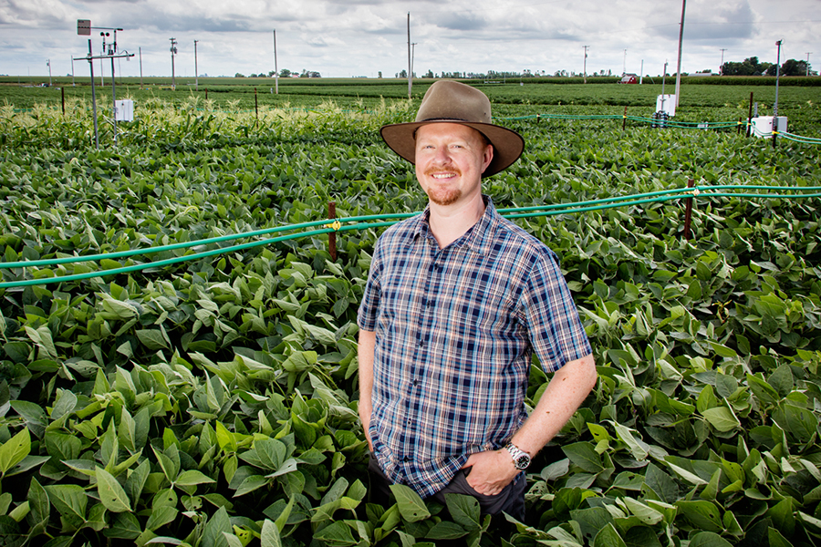 Professor of Plant Biology Andrew Leakey at the Soybean Free Air Concentration Enrichment system, which allows researchers to simulate future atmospheric conditions to determine their effects on plants. 