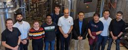 Illinois research team in front of a fermenter at IBRL