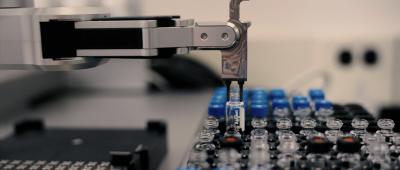 A robot positions "bloccs" for assembly via automated, iterative carbon-carbon bond formation. Credit: Molecule Maker Lab