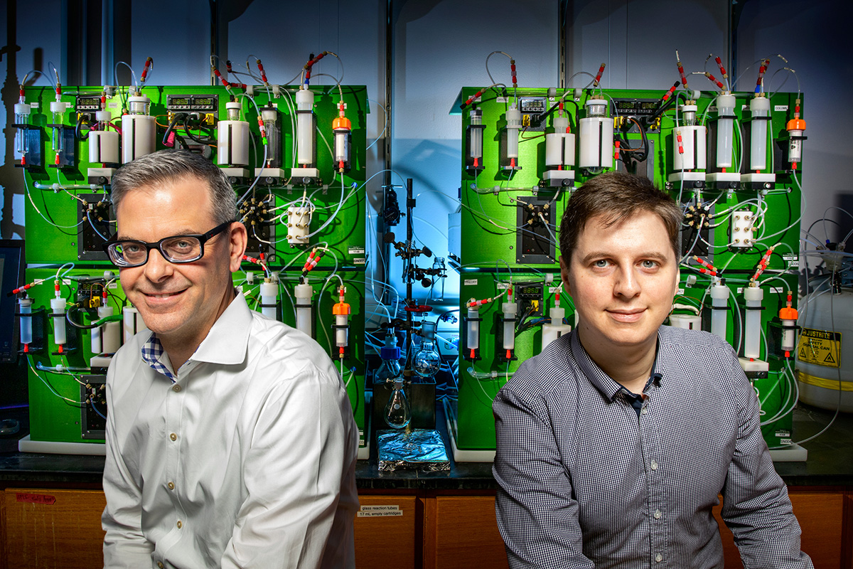University of Illinois chemistry professor Martin D. Burke, left, and postdoctoral researcher Daniel J. Blair developed a new class of chemical building blocks and a next-generation molecule-making machine to assemble them into complex small molecules with 3D twists and turns.