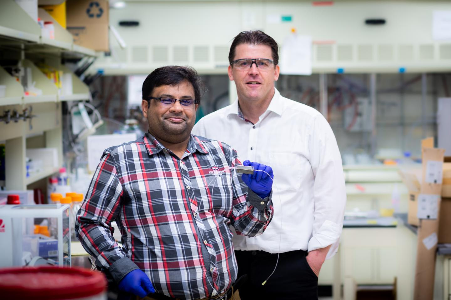Graduate student Saket Bhargava (left) and Chemical and Biomolecular Engineering Professor and Department Head Paul Kenis (right) report reducing the energy required for CO2 electrolysis by more than 60% in a flow electrolyzer using magnetism.