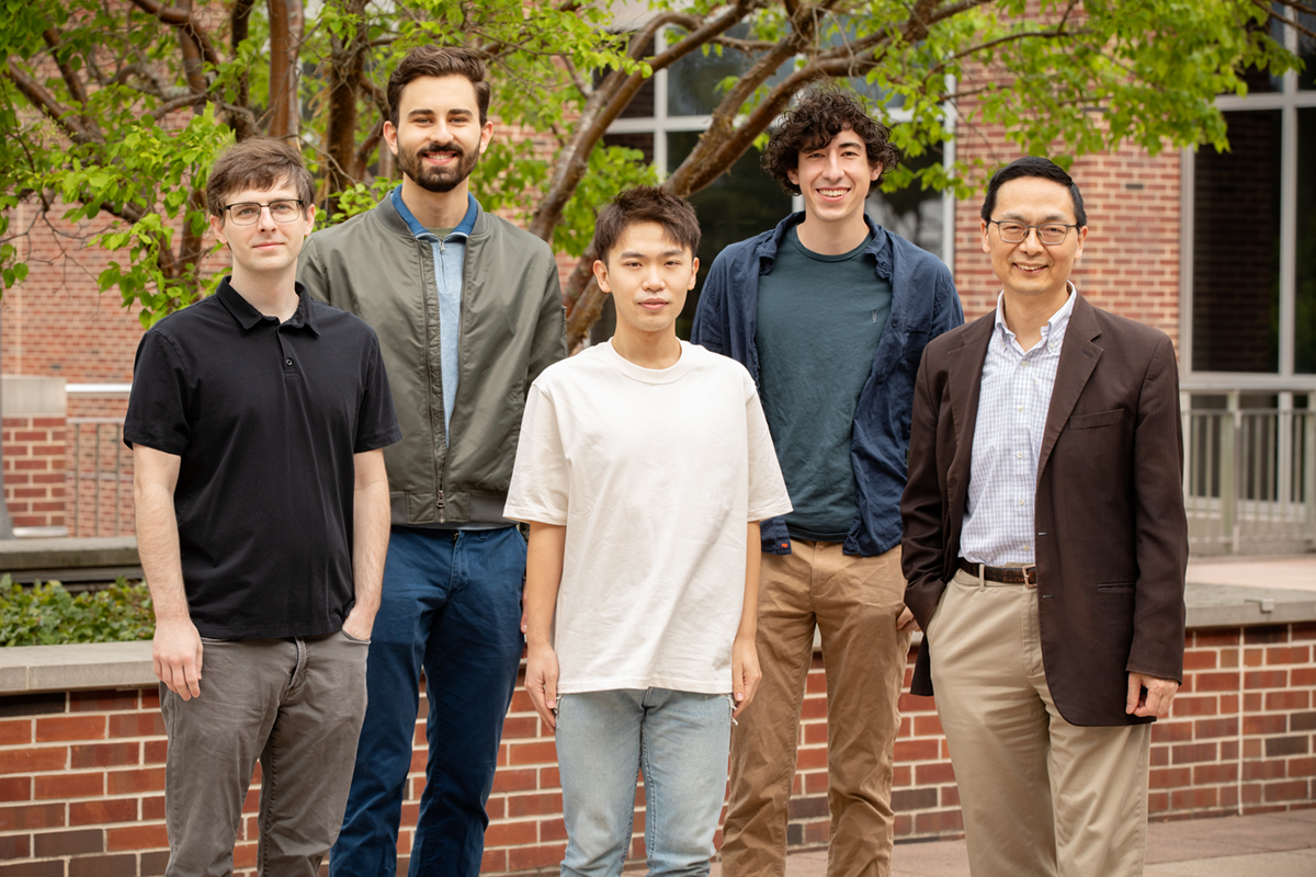 The research team included, from front left, Stephan Lane, manager of the Illinois Biological Foundry for Advanced Biomanufacturing; graduate student Guanhua (Daniel) Xun; Huimin Zhao, the Steven L. Miller Chair of chemical and biomolecular engineering, and a professor of chemistry, biochemistry, biophysics, and bioengineering. In back, from left, electrical and computer engineering undergraduate student Vassily Petrov; and mechanical science and engineering undergraduate student Brandon Pepa, who recently graduated.