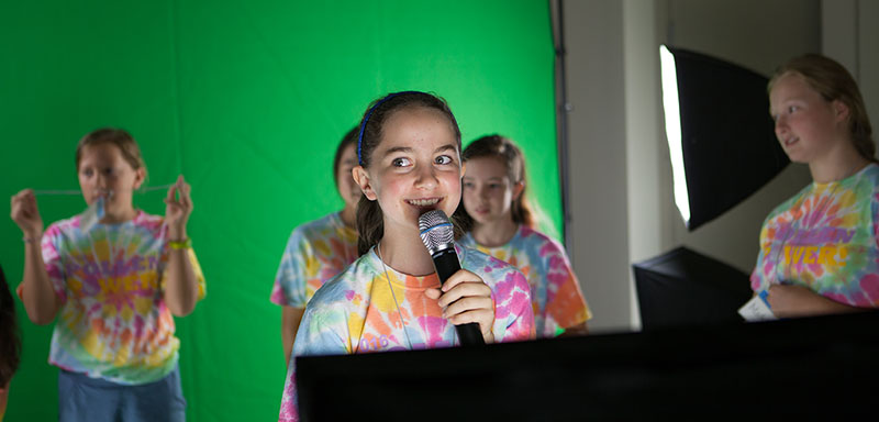 Campers wrote and performed newscasts in front of a green screen to produce final videos at the conclusion of the week.
