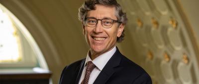 Gene E. Robinson as the new Executive Director and CEO of the Discovery Partners Institute (DPI).