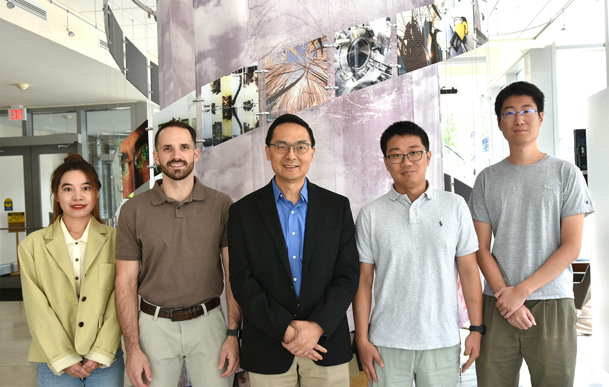 The research team, from left: Postdoc Yujie Yuan, Ph.D. Candidate Wesley Harrison, CABBI Conversion Theme Leader Huimin Zhao, Postdoc Maolin Li, and Postdoc Zhengyi Zhang.