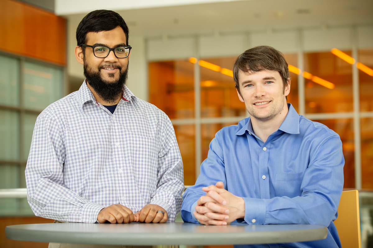 Illinois professor Andrew Smith, right, and graduate student Mohammad Zahid developed a technique to track molecules that deliver drugs and genes to cells.