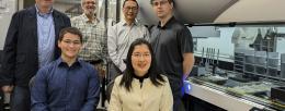 The CABBI research team and the iBioFAB biofoundry at the Carl R. Woese Institute for Genomic Biology (IGB). Front row, Graduate Student Seth Croslow and Research Scientist Jia Dong. Back row, from left: Co-PIs Mathew Hudson, Jonathan Sweedler, Huimin Zhao and Biofoundry Manager Stephan Lane. Credit: Julie Wurth/CABBI