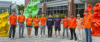 The authors highlighted their collaborative team effort by sporting their Illini Orange and Blue. From left to right: Hankeun Lee, Joseph Tibbs, Amanda Bacon, Takhmina Ayupova, Leyang Liu, Anqi Tan, Wang-Chien Chen, Saurabh Umrao, Seemesh Bhaskar, Brian Cunningham, Xing Wang / Isaac Mitchell