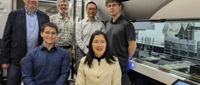 The CABBI research team and the iBioFAB biofoundry at the Carl R. Woese Institute for Genomic Biology (IGB). Front row, Graduate Student Seth Croslow and Research Scientist Jia Dong. Back row, from left: Co-PIs Mathew Hudson, Jonathan Sweedler, Huimin Zhao and Biofoundry Manager Stephan Lane. Credit: Julie Wurth/CABBI