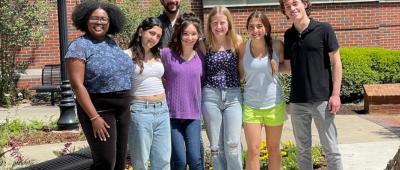 Terence Crofts’ research group, including paper co-authors Ezabelle Frank (far left), Terence Crofts (behind the group), Elizabeth Bernate (center, in purple), and Hayden Allman (far right). 